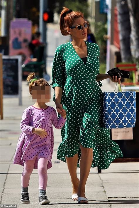 Eva Mendes is flirty and feminine in chic wrap dress | Daily Mail Online