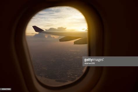 view of window seat on board of airplane with incredible cloud and ...