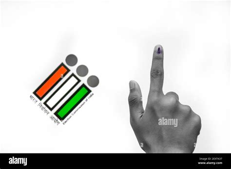 Indian Voter Hand with voting sign and ink pointing vote for India behind on election commission ...