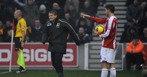 Stoke City's Rory Delap tries to take a throw in as Hull City's Dean ...