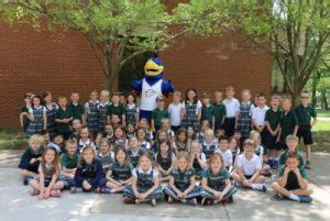 Spalding mascot Ollie the Eagle swoops in to meet St. Patrick Catholic School first-graders ...