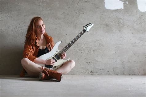 Young Red-haired Girl with an Electric Guitar. Rock Musician Gir Stock ...