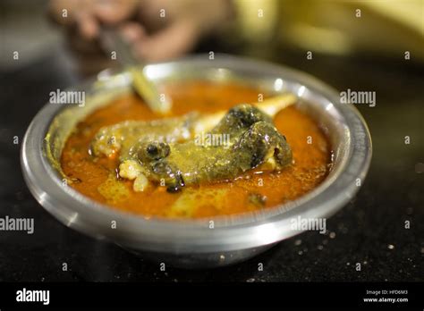 Close-up of Mutton Paya Soup served in a small stainless steel bowl. Paya is a soup made with ...