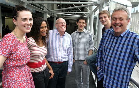 a group of people standing next to each other