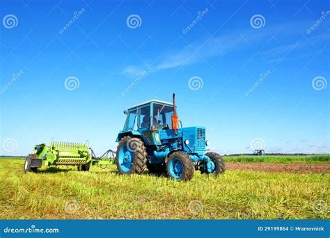 Tractor on a farmer field stock photo. Image of alfalfa - 29199864