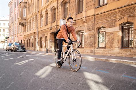 Premium Photo | A man on a business bicycle goes to work urban eco ...