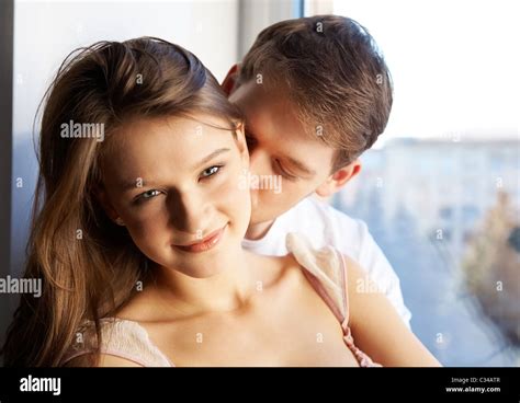 Close-up of young man kissing in woman’s neck Stock Photo - Alamy