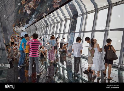 Visitors taking in views of Shanghai from the observation deck of the ...