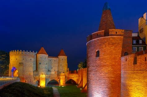 Premium Photo | Night barbican in the old town of warsaw, poland