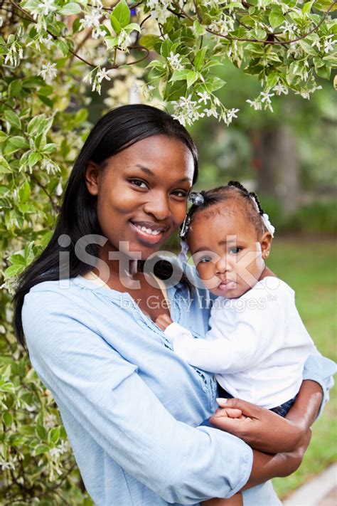 African American Mother Holding Baby Girl Stock Photo | Royalty-Free | FreeImages