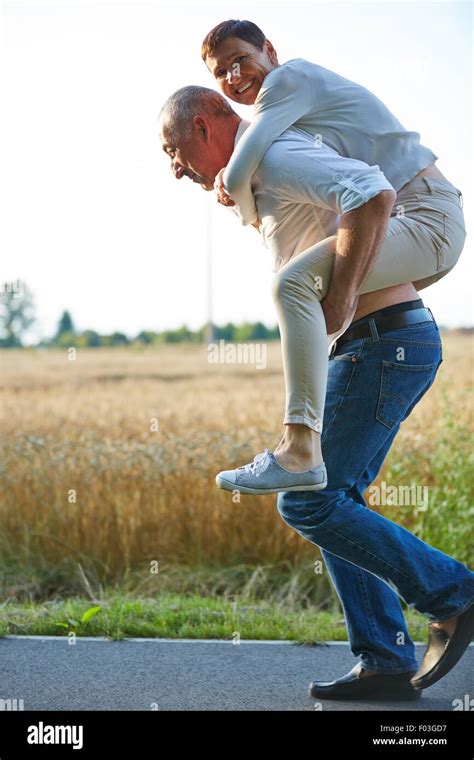 Couple piggyback carry hi-res stock photography and images - Alamy