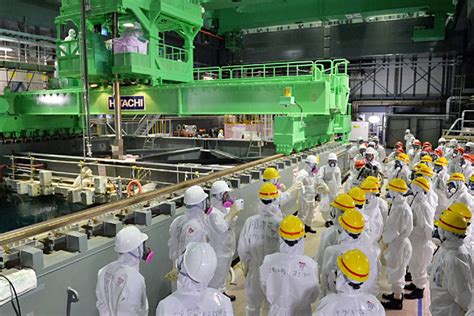 Operator of Japan's Fukushima plant cuts profit forecast; no risk to ...