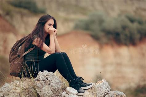 Sad Woman Sitting on a Rocky Cliff Terrified of Heights Stock Photo - Image of camper, cliff ...