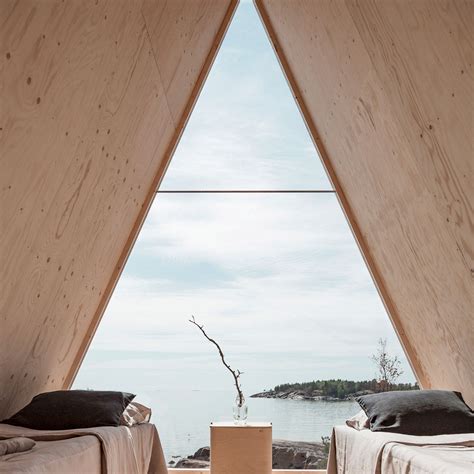 Finnish designer Robin Falck has created an A-frame mirrored micro-home on an island near ...