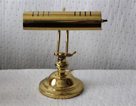 Antique brass desk lamp offers a dignified friendly look in the parlor - Warisan Lighting