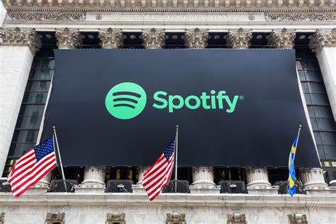 Spotify stock begins trading at $165.90 a share, placing company ...