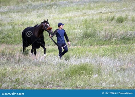 Young Asian Man is Walking with His Pure Breed Kazakh Horse in Kazakhstan Steppe Editorial Image ...