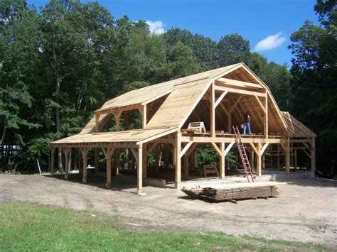 Cordwood frame with gambrel roof - like the structure design of this, smaller for a cabin maybe ...