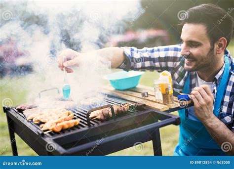 Handsome Male Grilling Meat Outdoor Stock Photo - Image of barbecue ...