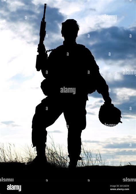 Silhouette of US soldier with rifle against a sunset Stock Photo - Alamy