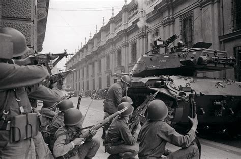 Troops led by General Augusto Pinochet siege La Moneda Palace, where President Salvador Allende ...