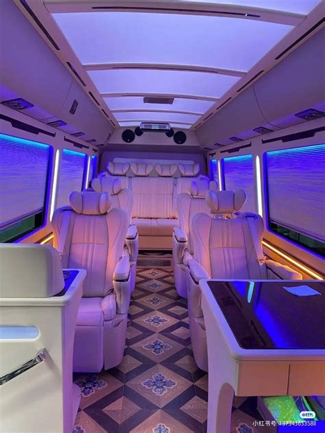 Luxury Van Interior with Blue Lights and White Leather Seats