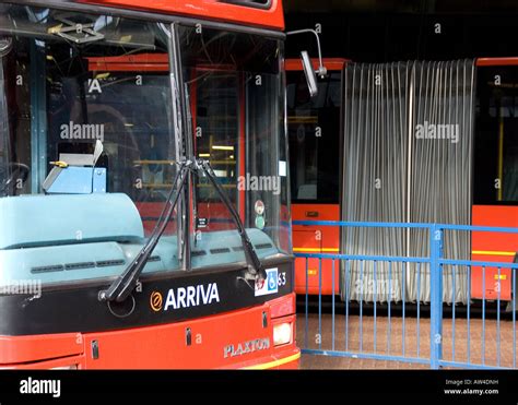 double decker and bendy red buses outside railway station in london ...