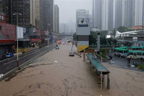 Floods swamp Hong Kong streets after record rainfall in wake of Super ...