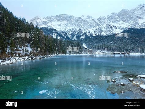 Eibsee lake winter view with thin layer of ice on the surface, Bavaria ...