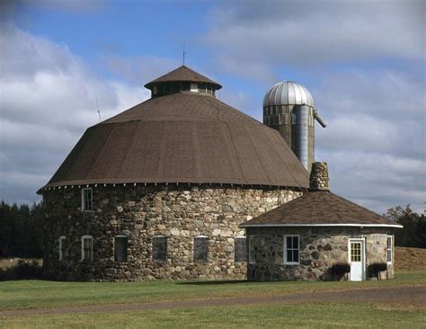 Beautiful round stone barn. Wonder if they live in this? If not... wouldn't it be a cool house ...