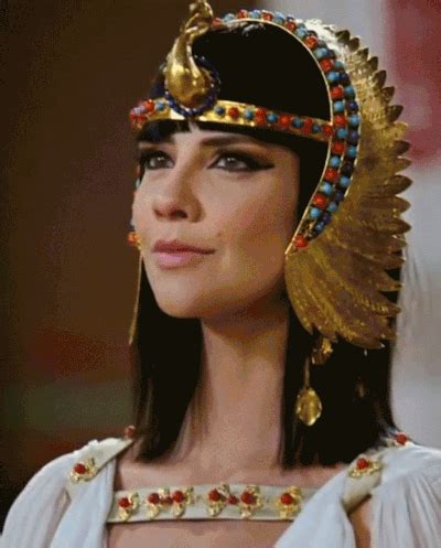 an egyptian woman wearing a gold headpiece