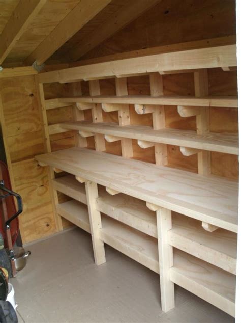 the inside of a storage room with wooden shelves