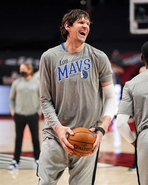 Boban holding a basketball with both hands : bobanholdingthings