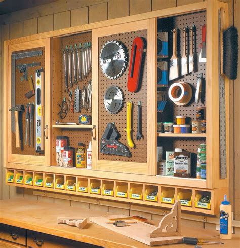 Workshop sliding door pegboard tool storage. Plans: http://www ...