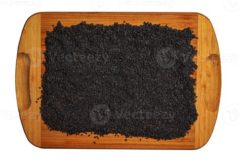 Black sesame seeds on a wooden kitchen board. Healthy food concept. 16548830 PNG
