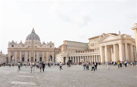 Premium Photo | Tourists on the st. peter's square, architectural masterpiece with michelangelo ...