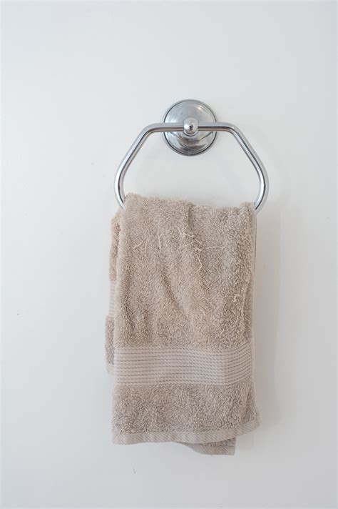 Free Stock Photo 6923 Beige hand towel hanging in a bathroom | freeimageslive