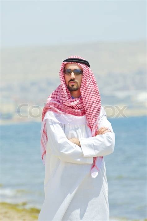 Arab on seaside in traditional clothing | Stock Photo | Colourbox