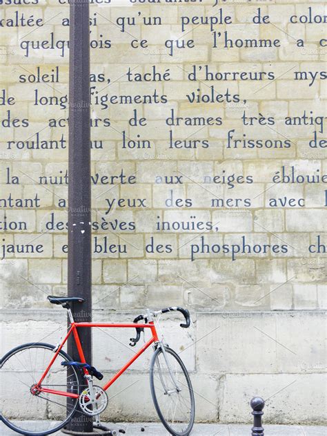 Le Bateau Ivre poem on Paris wall | High-Quality Holiday Stock Photos ~ Creative Market