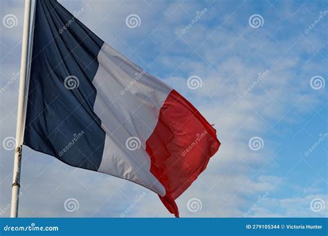 Straight on View of a Waving French Flag Against a Bright Blue Sky ...