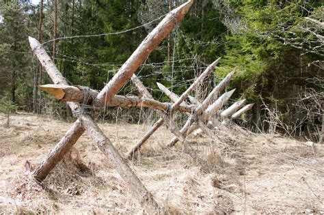 Wooden barricade with a barbed wire by Nikolai Tsvetkov Survival ...