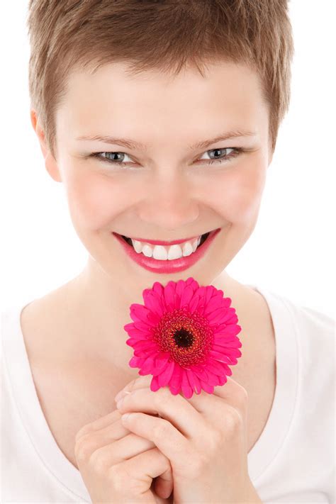 Smiling Woman With A Flower Free Stock Photo - Public Domain Pictures