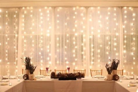 These Ideas for Wedding Arches with Lights Really Dial Up the Wow Factor