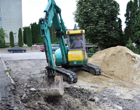 Mini Excavator Works on Road Repair Editorial Photo - Image of repair ...