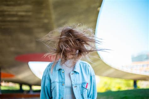 Premium Photo | Woman tossing hair while standing outdoors