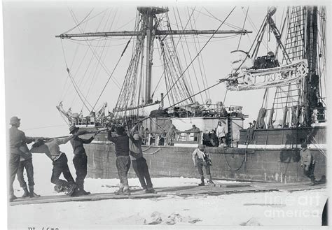 Men Lowering A Motor Sledge For Ship Photograph by Bettmann - Fine Art America