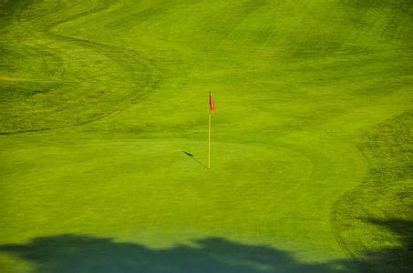 Royalty-Free photo: Selective focus photography of golf ball on golf ...