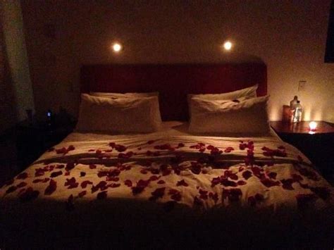 Rose Petals On Bed With Candles | Romantic room surprise, Romantic ...