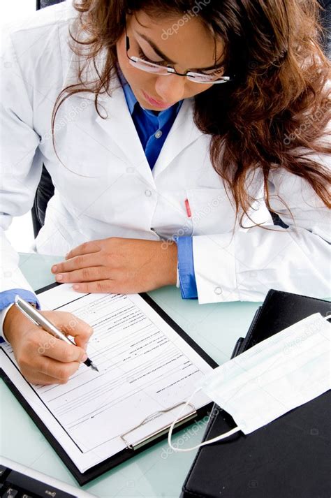 Young doctor writing prescription — Stock Photo © imagerymajestic #1351420