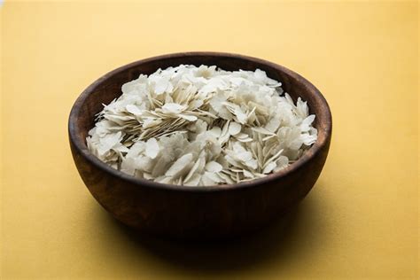 Premium Photo | Raw Flattened Rice or Thick or thin Rice Flakes for ...